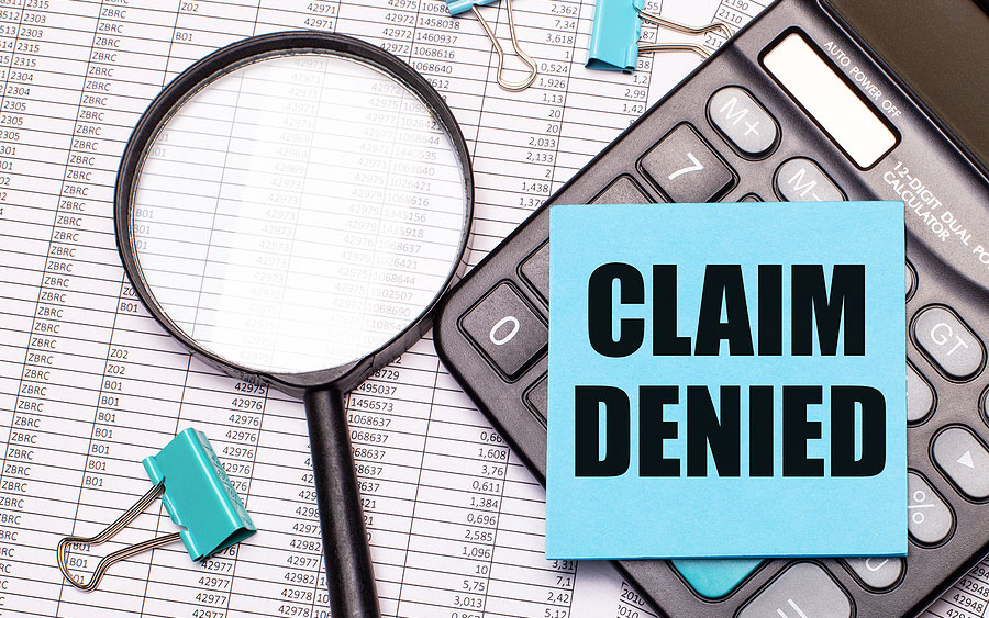 Claim denied with chart, calculator, and magnifying glass